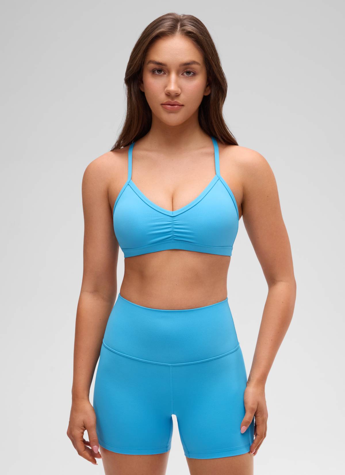 CRZ YOGA Butterluxe حمالة صدر رياضية مبطنة لليوجا برقبة على شكل V مكشكشة للنساء بلون أزرق كاياك