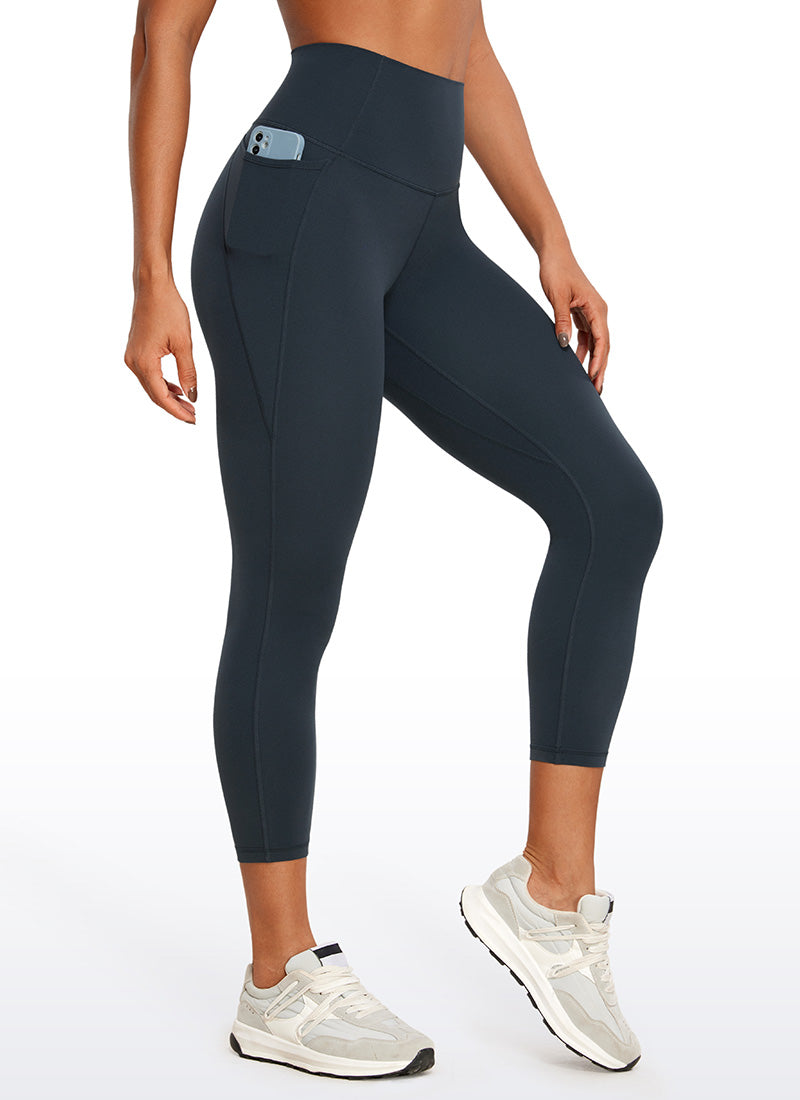 CRZ YOGA - ليغينغز نسائي بخصر Butterluxe وجيوب Butterluxe بطول كابري 23 بوصة، لون أزرق داكن أصلي