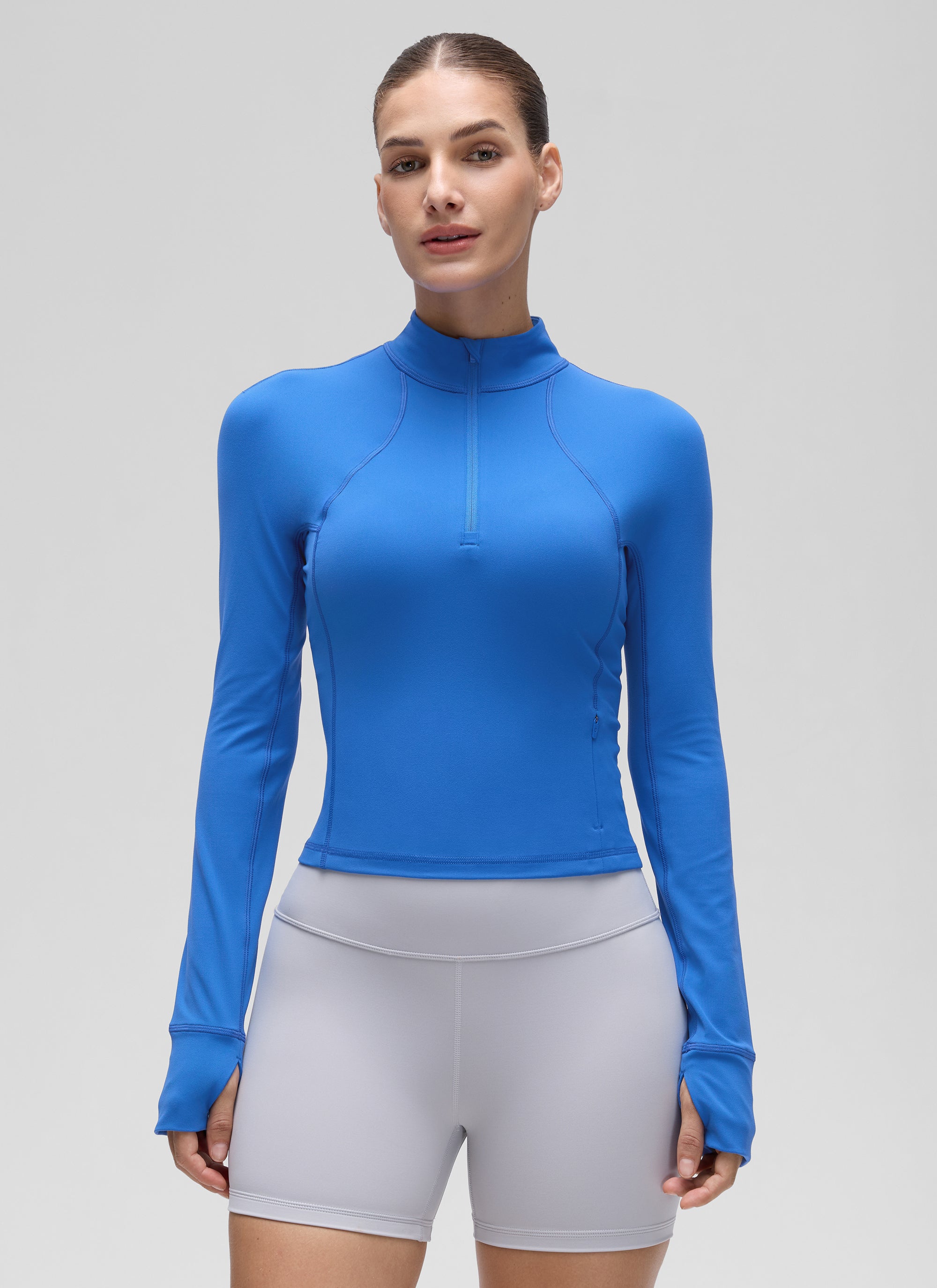 بلوزات نسائية ضيقة لليوغا بسحاب نصف وأكمام طويلة Butterluxe بلون أزرق لامع من CRZ YOGA